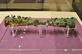 Zylinderförmiger Gegenstand aus Goldbronze