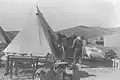 FAMILY MOVING THEIR FURNITURE INTO A TENT AT KIBBUTZ HAZOREA