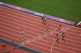 Zieleinlauf Vorlauf 4: Lorène&nbsp;Bazolo (Bahn&nbsp;2), Feta&nbsp;Ahamada (B.&nbsp;3), Michelle-Lee Ahye (B.&nbsp;4), Tatjana&nbsp;Pinto (B.&nbsp;5), Blessing&nbsp;Okagbare (B.&nbsp;6), Tianna&nbsp;Madison (B.&nbsp;7), Nimet&nbsp;Karakus (B.&nbsp;8), Andreea&nbsp;Ogrăzeanu (B.&nbsp;9)