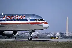 A Boeing 757, registration N64AAA, at Ronald Reagan Washington National Airport in March 1995