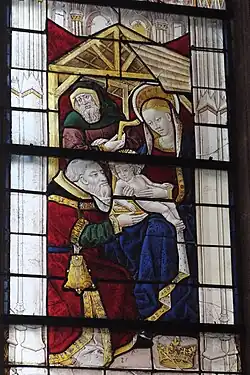 Einer der Heiligen Drei Könige vor Maria mit dem Jesuskind, dahinter Josef