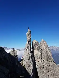 Kletterer am Fusse und zuoberst auf der Fiamma.