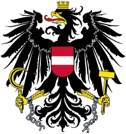 Ein Adler als Schildhalter im Wappen der Republik Österreich (siehe auch Brustschild)