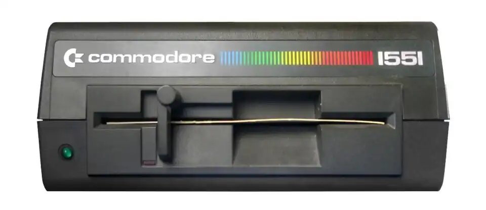 Vorderseite mit Netzleuchte (grüne Leuchtdiode), Aktivitätsanzeige (rote Leuchtdiode) und Knebelmechanik mit eingelegter Transportsicherung