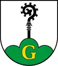 Gundelshausen In Silber (weiß) aus einem grünen, mit goldenem (gelbem) lateinischen Großbuchstaben G belegten Dreiberg wachsend ein schwarzer Abtsstab.