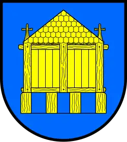 Das Wappen von Husby mit dem Holzhaus