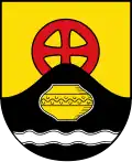 Das rote Radkreuz im Wappen symbolisiert den Fund am Langen Berg