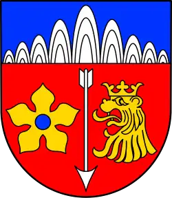 Eine goldene Mispel mit blauem Butzen im Wappen von Wallenborn