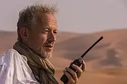 Dirk van den Berg filming in the Saudi Arabian desert.
