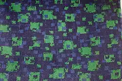 Polstersitz mit kleinteilig-chaotischem Muster zur Verhinderung von Graffiti bei der London Underground