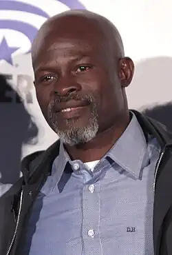 Djimon Hounsou (2016) spielt Chief Mbonga