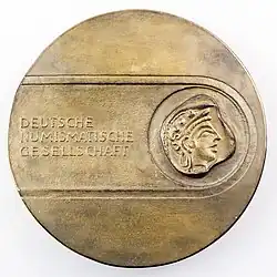 Eligiuspreis-Medaille (von 1992 bis 2019 vergebene Form) des Preisträgers Peter Götz Güttler (Bronzierter Weißmetallguss, 106&nbsp;mm, um 700&nbsp;g)