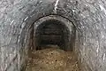 Blick in den versperrten Hohlgang zur Poudriere von Fort Souville,
