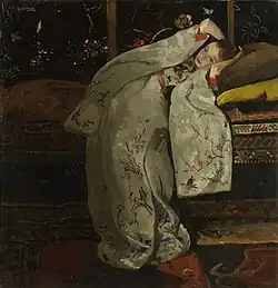 Meisje gekleed in een kimono, achterover liggend op een bank, 1894