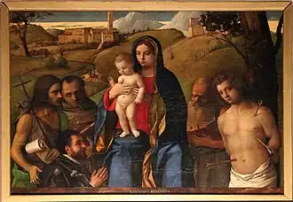 Giovanni Bellini: Madonna mit den Hl. Johannes d. Täufer, Franziskus, Hieronymus, Sebastian und Stifter, 1507
