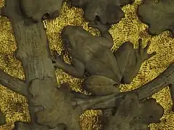 Ein Frosch auf goldenem Grund