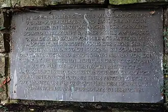 Texttafel am Grinkenschmied-Denkmal