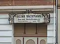 Werbetafel der 1891 gegründeten Bau- und Möbeltischlerei Heinrich Bachmann