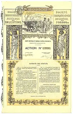 Gründeraktie der zionistischen Hermon Société Industrielle & Agricole en Palestine über 100 Francs, ausgegeben am 28. November 1906 in Paris. Die künstlerische Gestaltung der Aktie stammt von Edward Loevy. Auf der Aktie sind neben zwei weiblichen Allegorien auch jüdische Bauern zu sehen, die zum Füße des Berges Hermon mit einem Ochsengespann das Land ihrer Urväter bearbeiten.