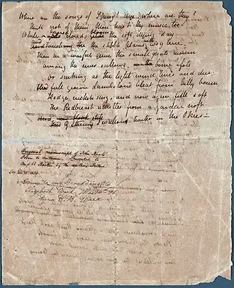 A white sheet of paper that is completely filled with a poem in cursive hand writing. A few of the words are scratched out with other words written above as corrections. Words can be partly seen from the other side of the page but they are illegible. A note midway down the page describes that it is an “Original manuscript of John Keats’s Poem to Autumn.”
