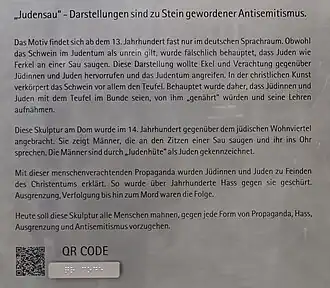 Hinweisschild (Ausschnitt) zur Judensau (seit 2023)