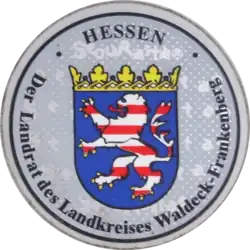 Bunter Löwe auf einer Stempelplakette