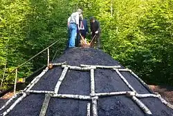 Entzündung eines Meilers durch Ehrengäste bei einem Meilerfest (2014)