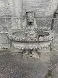 Brunnen mit Löwenskulptur