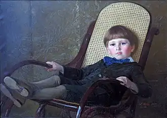 Erwin Nöbbe als Kind im Schaukelstuhl