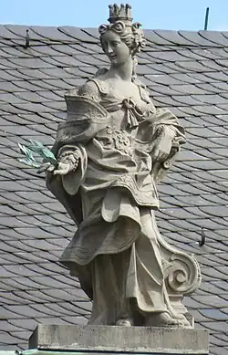 21. Gloria Principum (Fürstenruhm) – Krone, Lorbeerkranz, Stele.