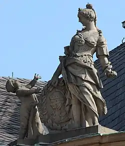 25. Prudentia (Klugheit) – Putto, Schuppenpanzer, Schlange, lorbeerumkränzter Schild mit Porträt eines Ehepaars.