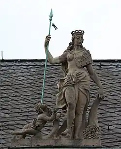 51. Kunst und Wissenschaft – Königin, Putte, Lanze, Krone, Hermelin, Füllhorn.