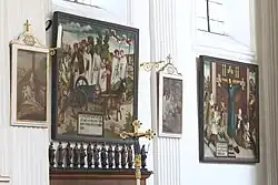 Gotische Bildtafeln mit Szenen der Wilgefortislegende, Apostelfiguren über dem Chorgestühl