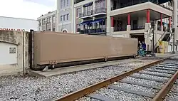 Flutmauer mit Schiebetor, New Orleans French Market (1986)