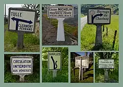 Zusammenstellung mehrerer Michelin-Wegweiser mit Standfuß