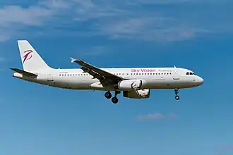 A Sky Vision Airlines Airbus A320 approaching Warsaw Chopin Airport in 2024
