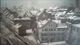 Fischerrain um 1902. Vorne mit Bahnwärterhaus; heute verläuft hier der Stadtring (Rusterberg). Am Horizont links die Heilig-Geist-Kirche, noch ohne vollendetem Hauptturm (provisorisches Dach)