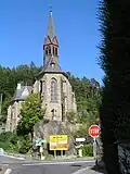 Schmitten Kirche, frontal von der Landesstraße&nbsp;3025 (Schillerstraße) aus fotografiert