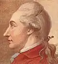 Johann Wolfgang Goethe in der roten Jacke mit Haarband nach links