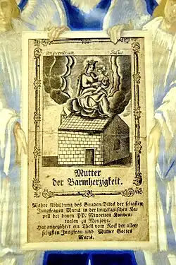 Schriftrolle im Ave-Maria-Bildstock