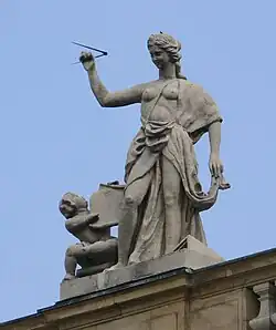 58. Architektur – Putto, Zirkel, Bauplan.