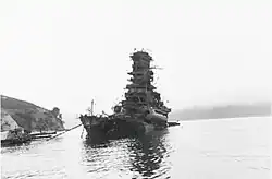 a heavily damaged Haruna, having sunk from the stern, several days after coming under attack at her moorings