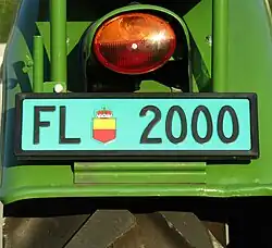 Grünes Kontrollschild für landwirtschaftliche Fahrzeuge