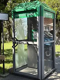 Telefonkabine mit Versionen des Guggisbergliedes