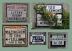 Zusammenstellung mehrerer Vorkriegswegweiser als Wandplatten