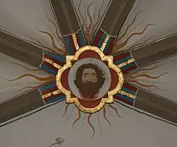 Schlussstein im Ostchor mit dem Haupt Johannes des Täufers