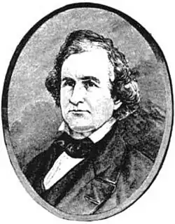 Gesichtsaufnahme ab Brusthöhe in schwarzweiß im Seitenprofil nach linksschauend.