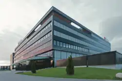 Reichle & De-Massari AG, company headquarters in Wetzikon, Switzerland, Canton ZH. The five-story company building is called “Kubus”. Opened in September 2010, the R&M Kubus company headquarters is a low-exergy class building.